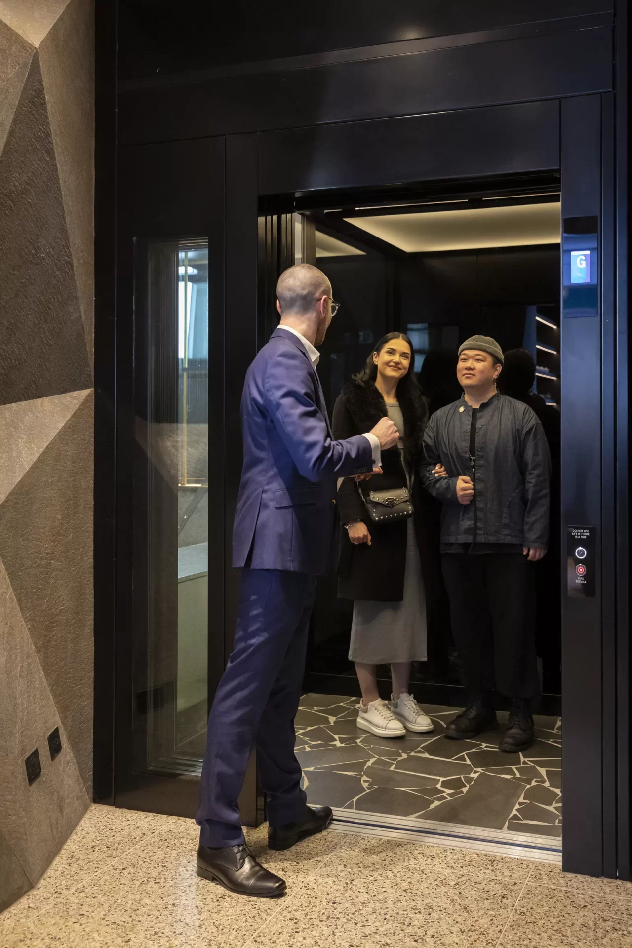 Men and Woman on the Elevator